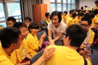 Prof Wong Suk Ying (Dean of Students) chatting with students at the Community Outreach Excursion Workshop held during the College Orientation Camp.